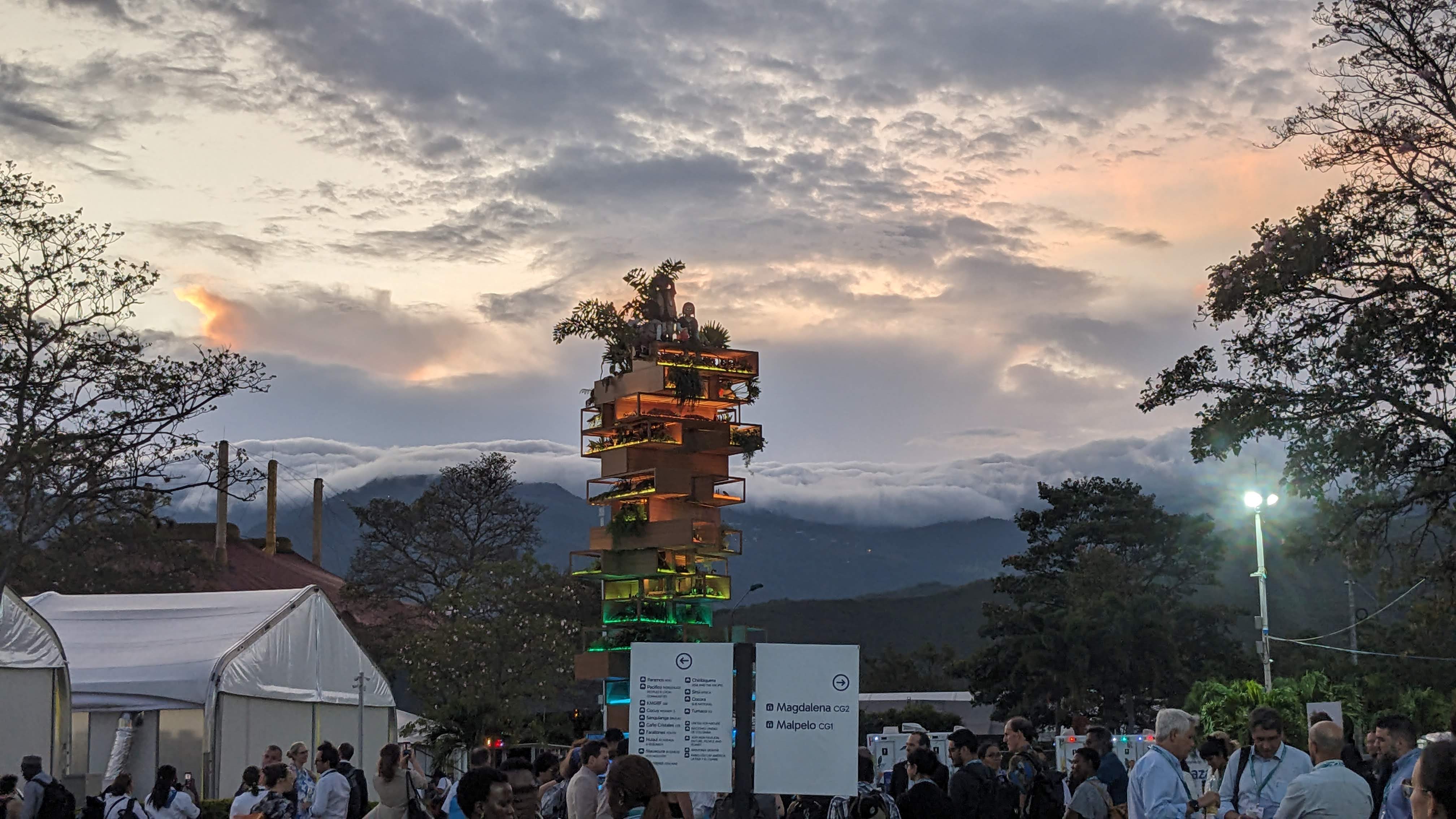 A view of hte COP16 event, the Colombian mountains are visible behind the events large marquees