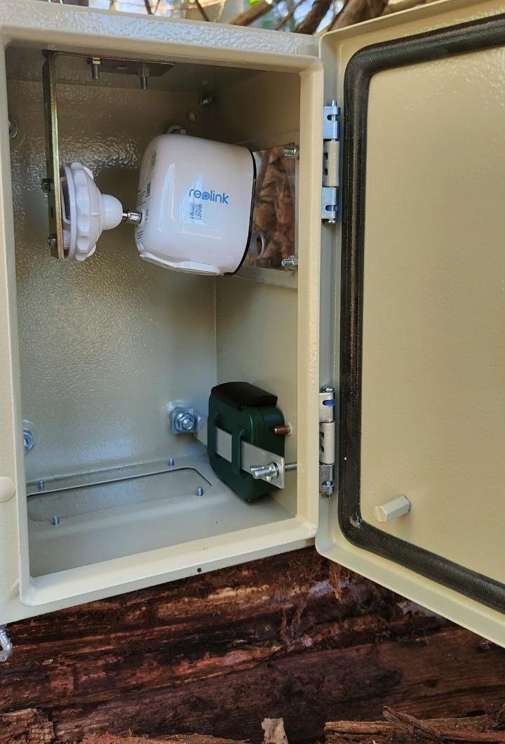 Metal box with surveillance camera and microphone